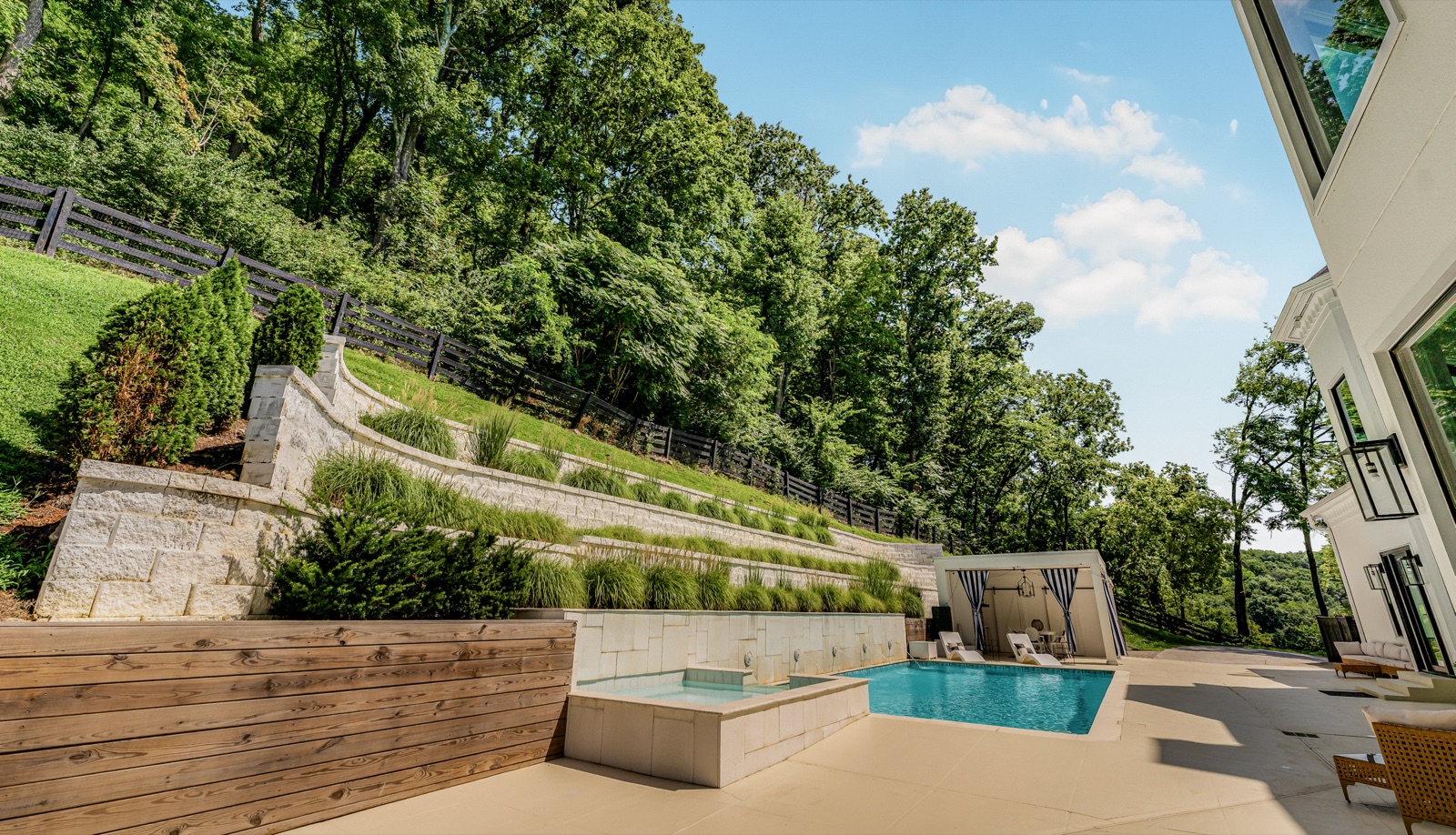 Terraced walls step the hillside down to the water