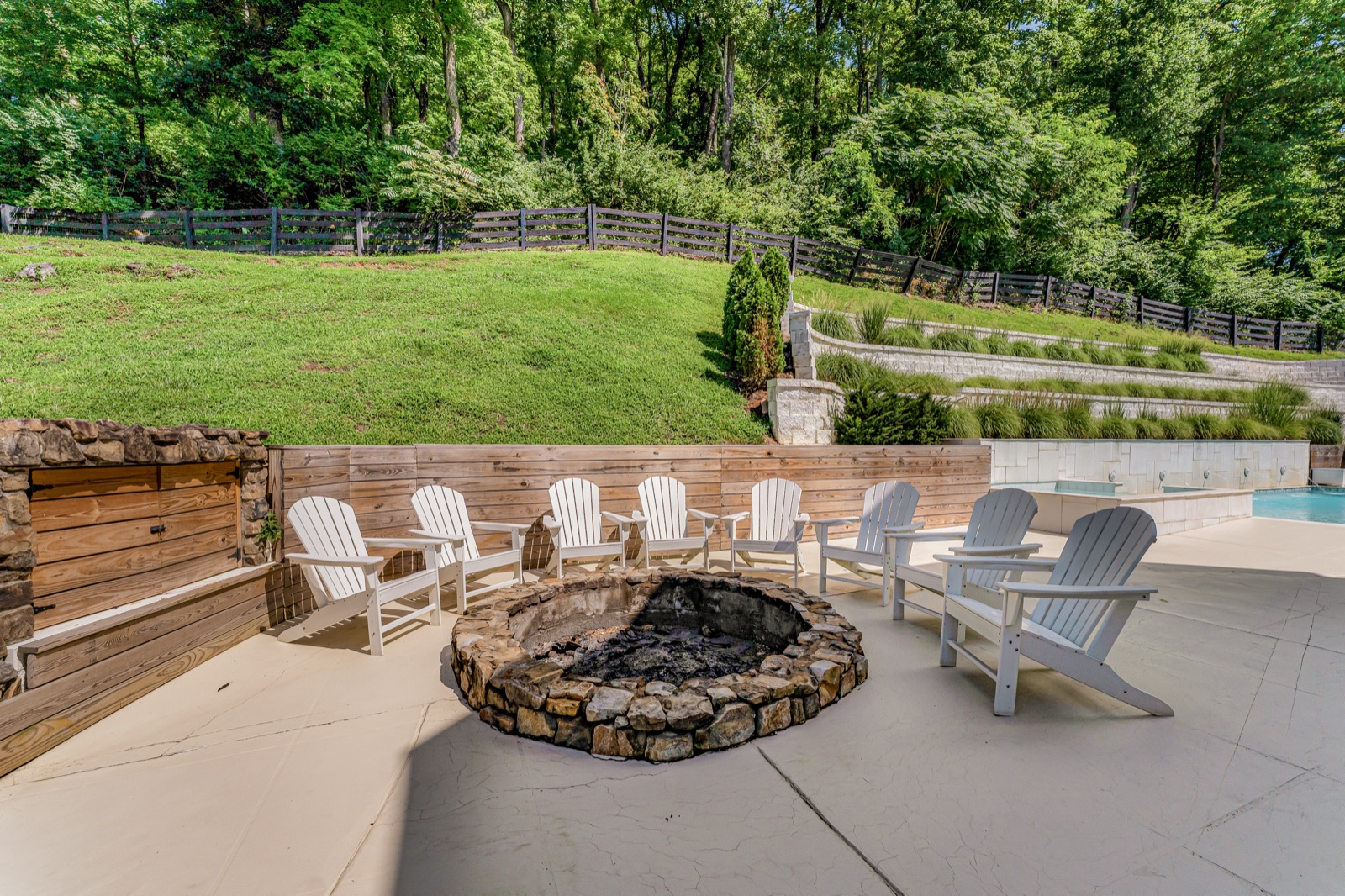 The stone fire pit, lumber stacked dry