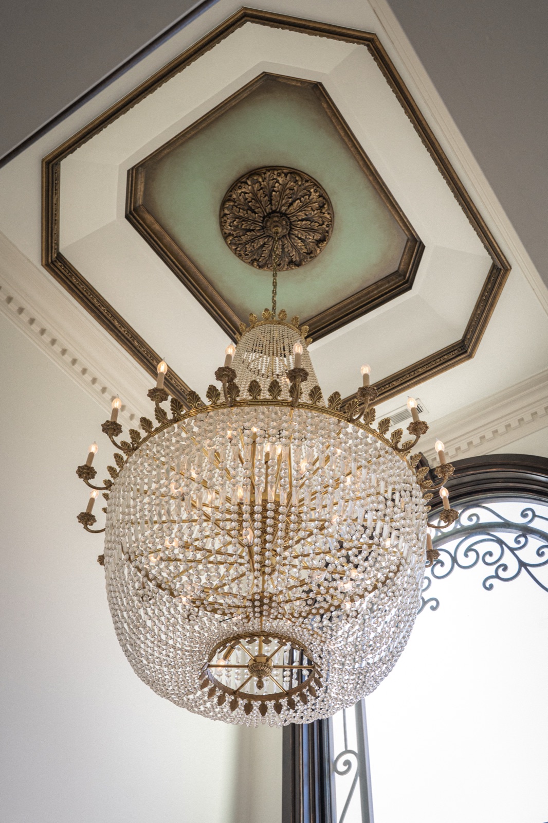 Designer chandeliers, medallioned ceilings