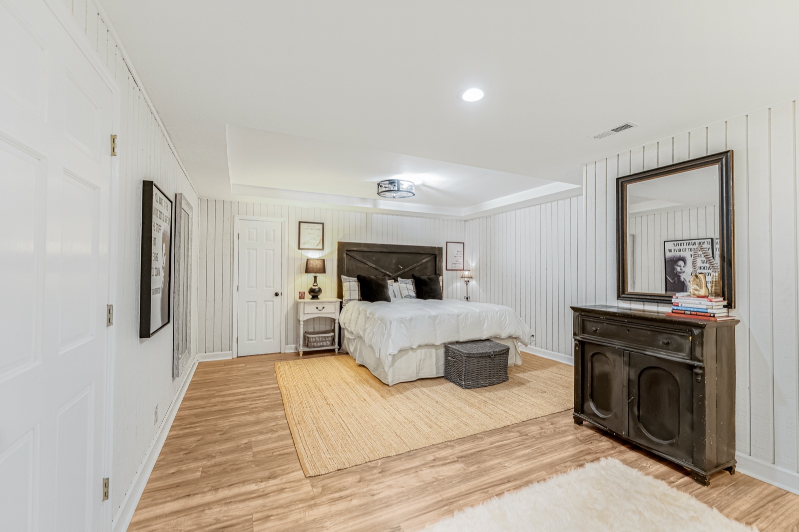 Bedroom five, on the lower level: paneled walls and its own quiet corner of the house.