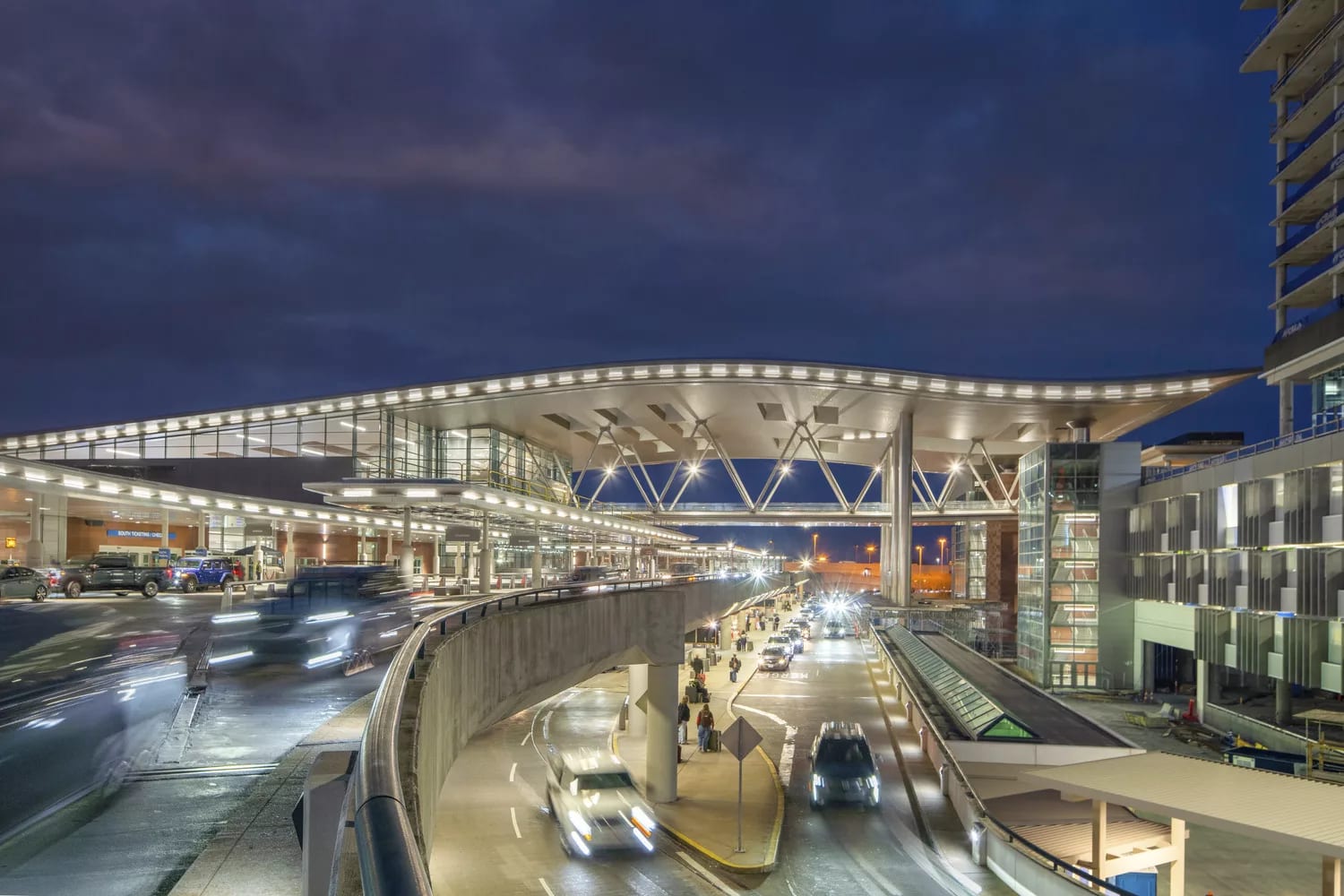 BNA at dusk: the new terminal's winged canopy over the departures drive.