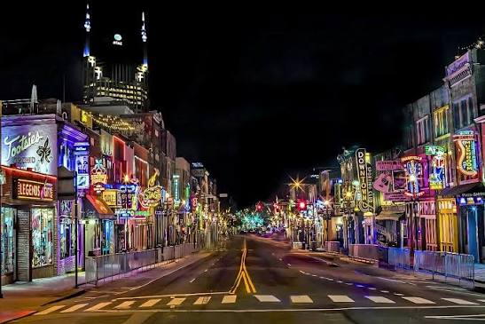 Nashville after dark: Lower Broadway's neon stacked shoulder to shoulder down the block.