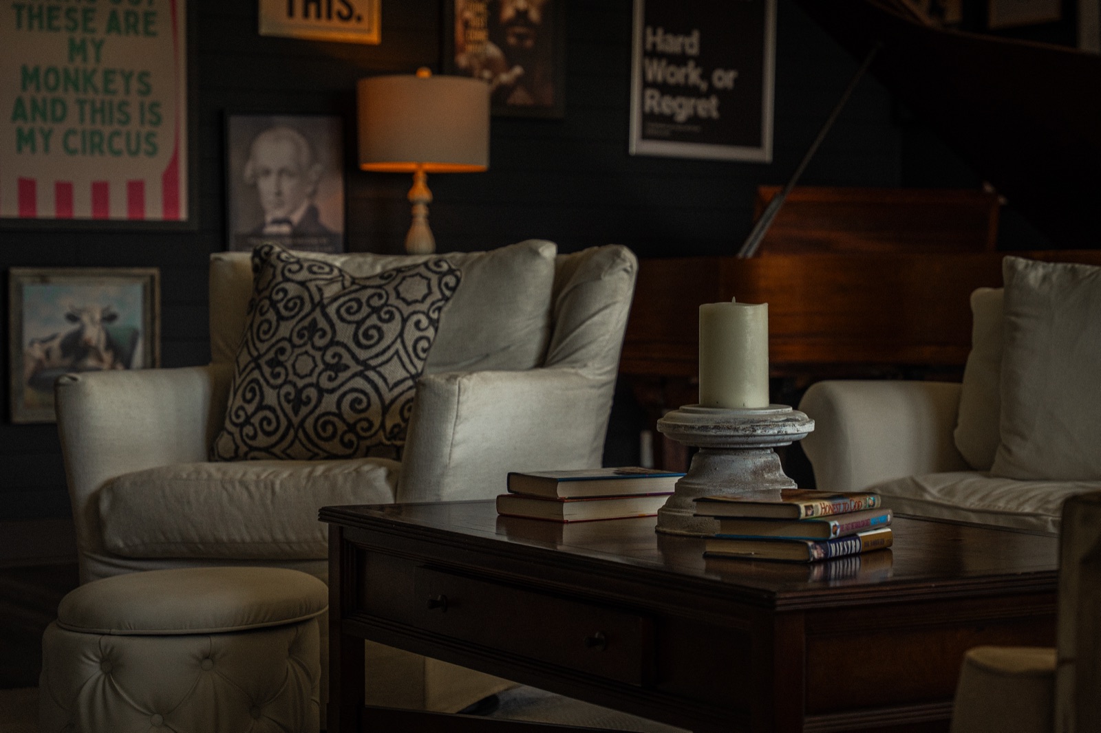 Reading light, books stacked, the grand behind